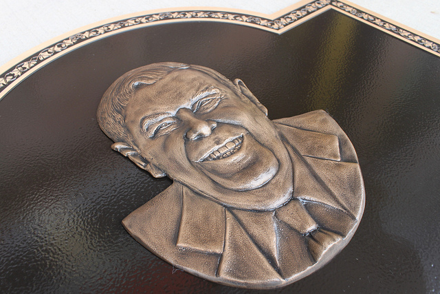 bas relief portrait attached to cast bronze plaque