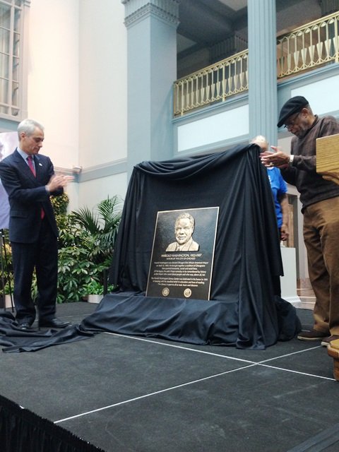 L-R: Chicago Mayor Rahm Emanuel and Dr. Conrad Worrill unveil the Harold Washington plaque at the Harold Washington Learning Center (HWLC) Nov. 14. 2014 (Photo Credit: Lee Edwards, Chicago Citizen