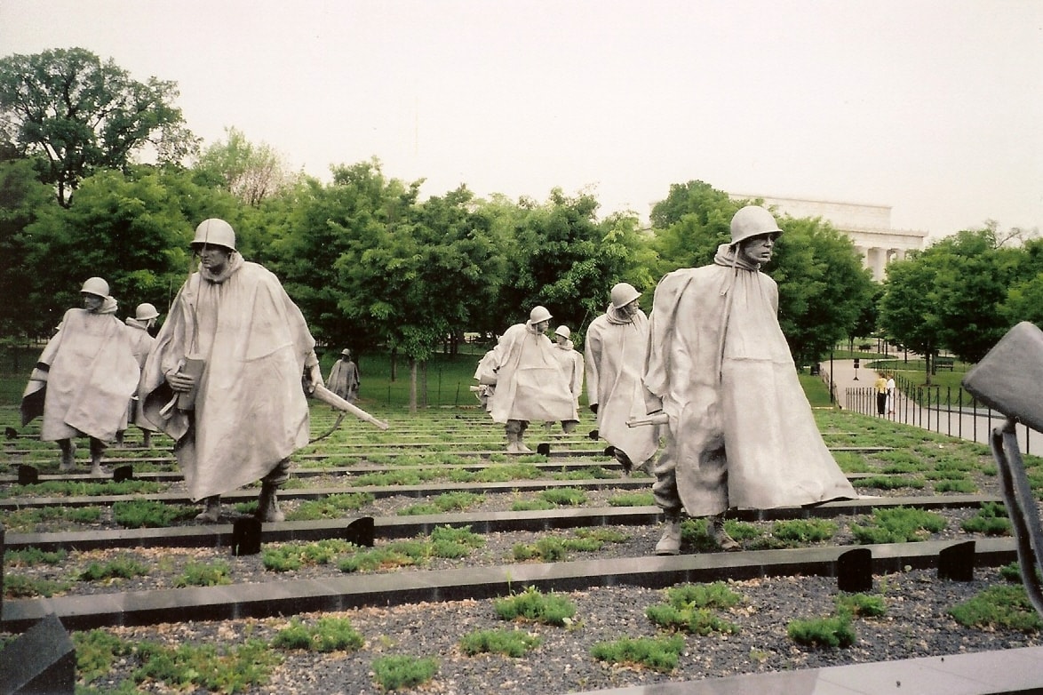 A part of the Korean War Veterans Memorial, this photo shows several large stainless steel statues depicting a U.S. squad on patrol.
