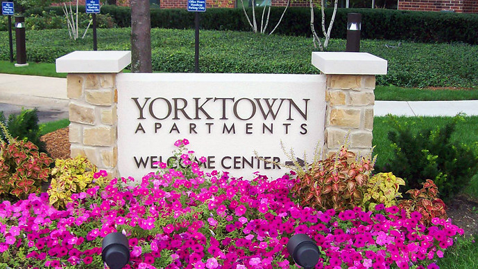 Foam monument sign with stone pillars on either side