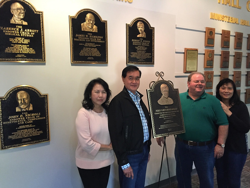 Cast bronze plaques with bas relief photos installed on a wall of fame