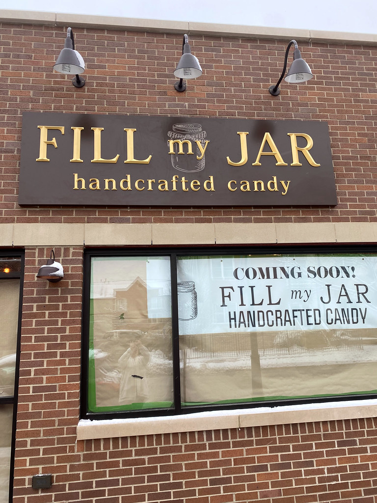 10 ft x 3 ft Fabricated panel 2" depth painted custom brown with cast aluminum letters (prismatic face font) painted brilliant gold and jar logo to be watermark painted on panel