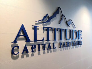 60" wide 3/8" thick acrylic logo Painted Matte Finish Dark Blue 2050 Flush Stud mounts with spacers to "float" each letter off the wall