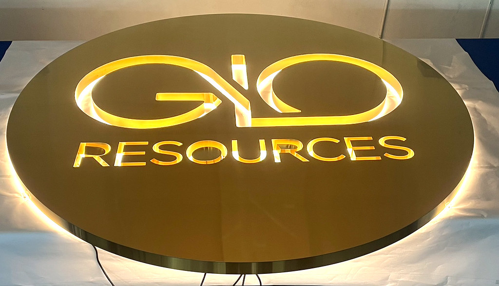 72" Fabricated Metal Circle Panel sign in Titanium gold ( brass ) Brushed finish 2" deep with Custom Letter Cut through so lighting shows inside (will see wall behind) Warm White LED Lighting NOTE: Inside fabrication returns for wall to show through