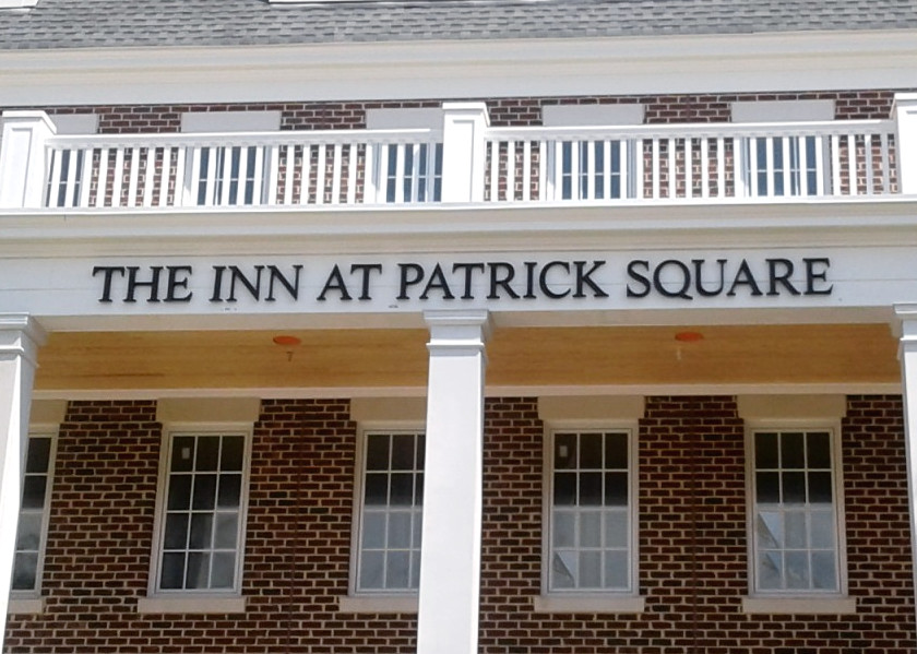 Black Painted Cast Aluminum letters with flush studs for exterior building identification signage