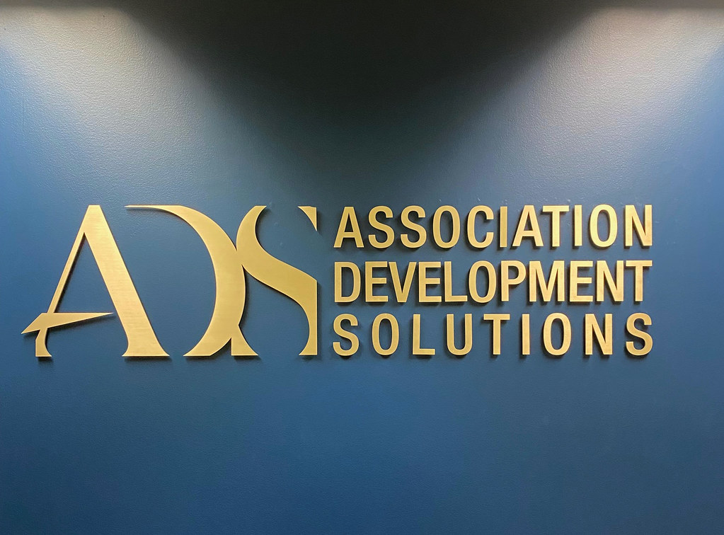 Brass Letters and logo  interior drywall sign