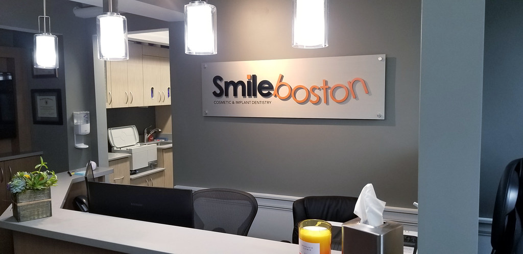 Brushed Aluminum Panel with Raised Aluminum Letters on Face for dental office lobby sign