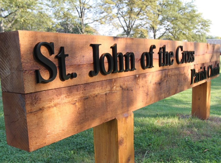 Custom wooden monument sign with Cast Aluminum letters assembled on face for outdoor use