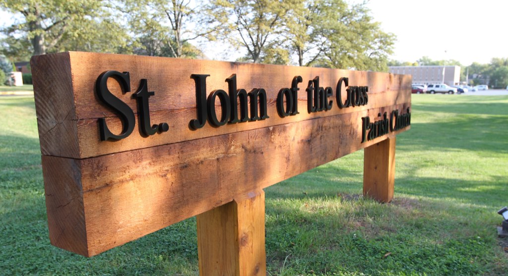 Custom wooden monument sign with Cast Aluminum letters assembled on face for outdoor use