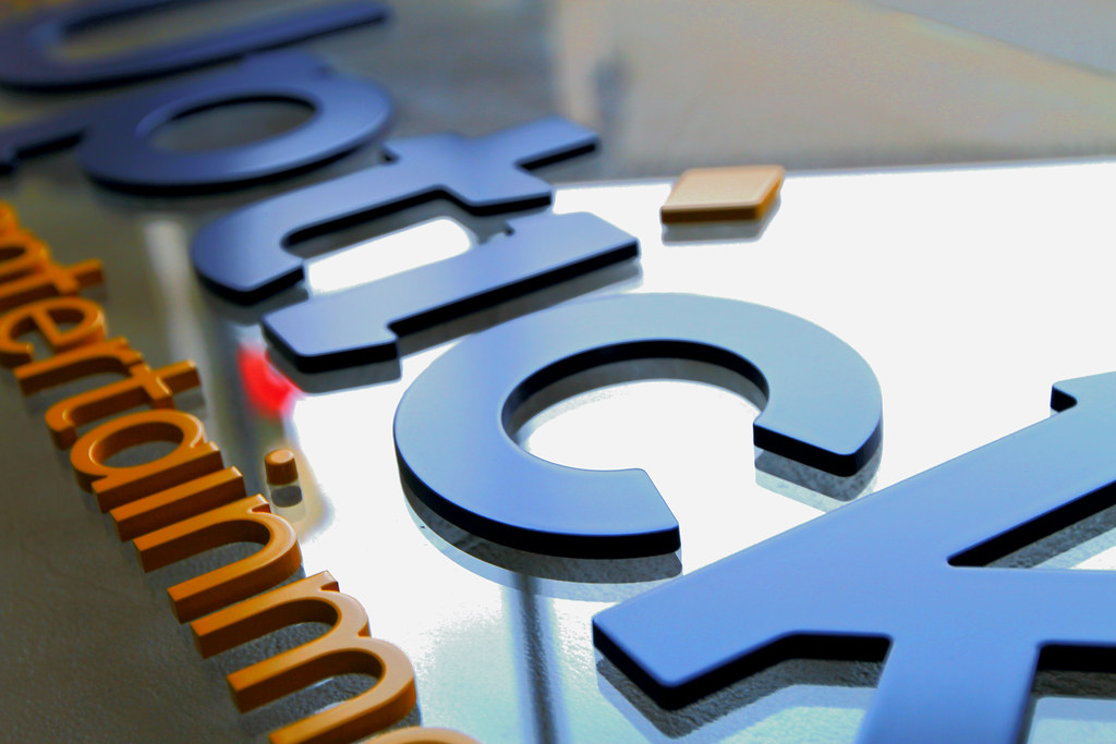 Cut Acrylic letters assembled on clear acrylic backer panel