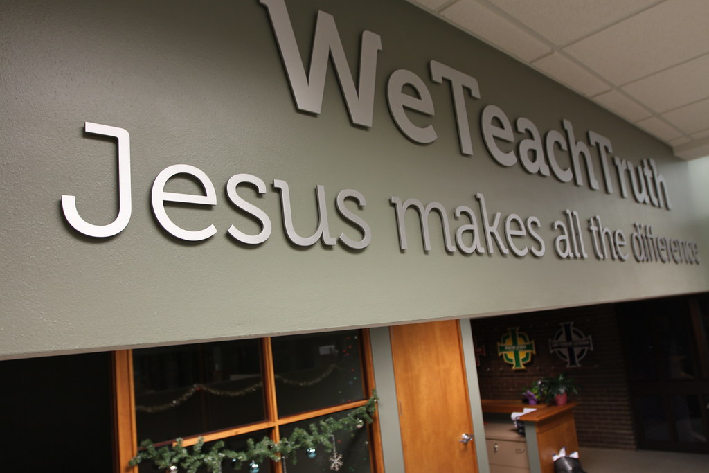 Cut Aluminum 12" Letters We Teach Truth 8" tagline Natural Brushed Finish 1/4" Thickness blind studs with spacers for interior drywall lobby