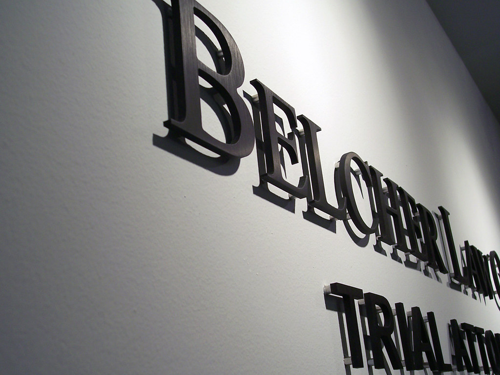 dark oxidized bronze letters