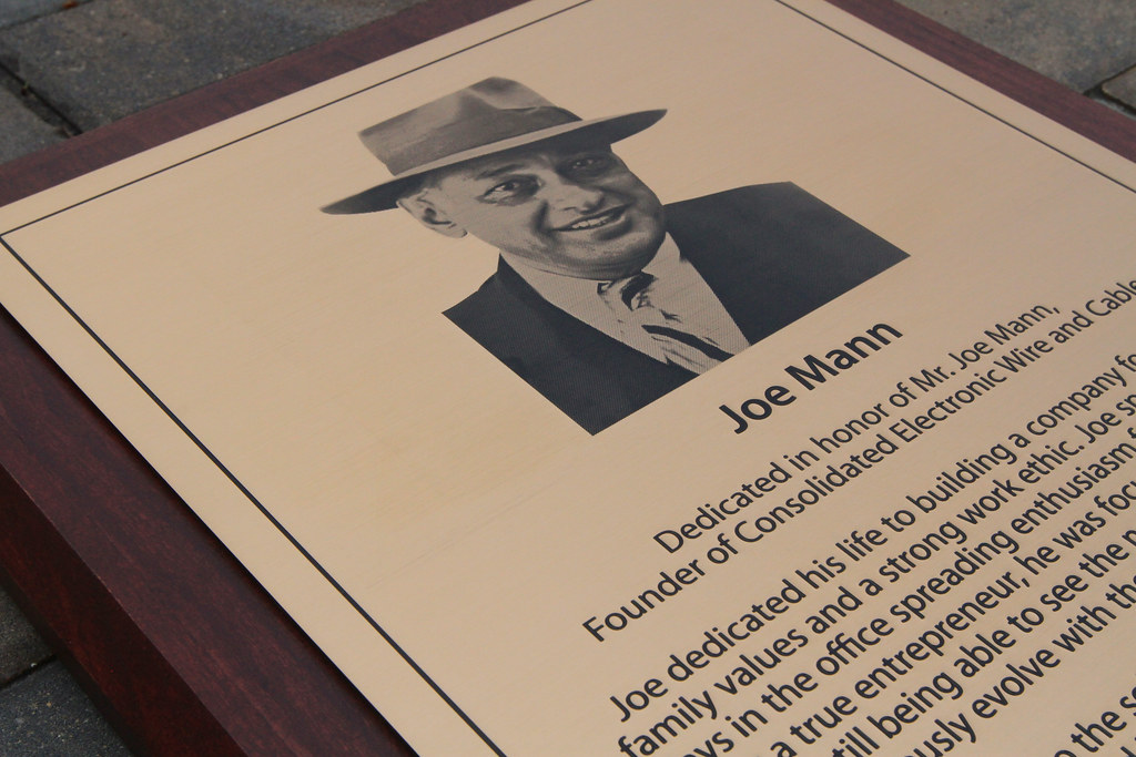 Detail etched bronze plaque with halftone image on wooden backer