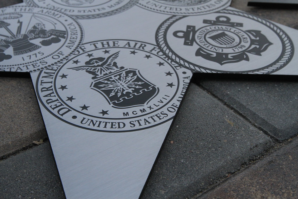 Etched Stainless Steel plaque in custom star shape with US Military insignias