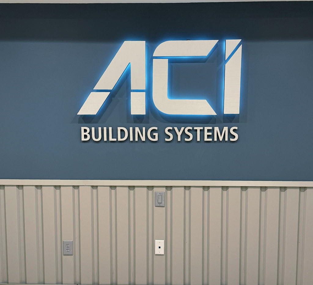 Fabricated backlit logo with cut lettering installed interior drywall lobby