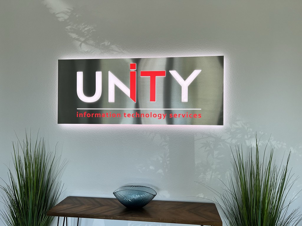 Fabricated panel sign with cut out accent lighted letters