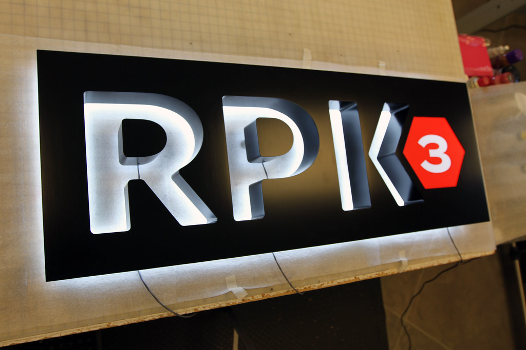 Fabricated panel sign with cut out accent lighted letters