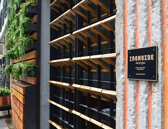 A view of a bronze name plaque designed to fit in with the ambience of the restaurant