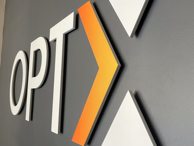 Overall 72" wide 1/2" thick White Acrylic letters with Gradient Print effect on accent X Stud and spacer mount for interior drywall