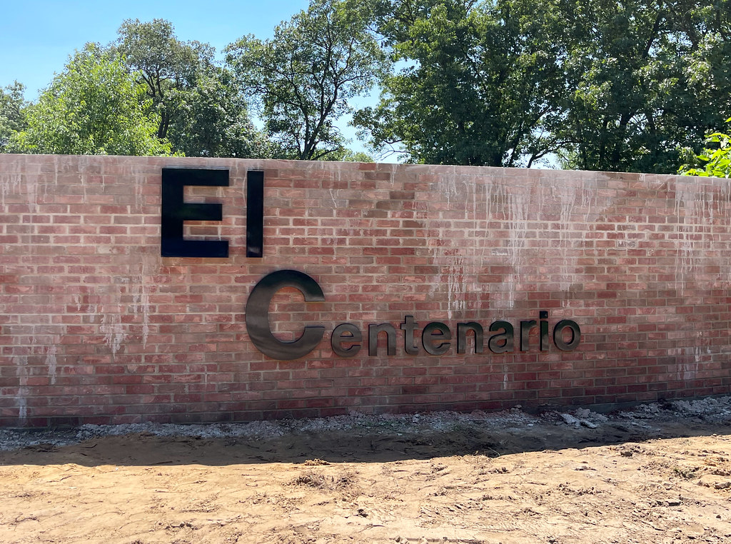 Painted Black Cast Aluminum letters 24" height 1.5 in depth: El C 12" height 1 in depth: entenario Helvetica font Blind studs for brick