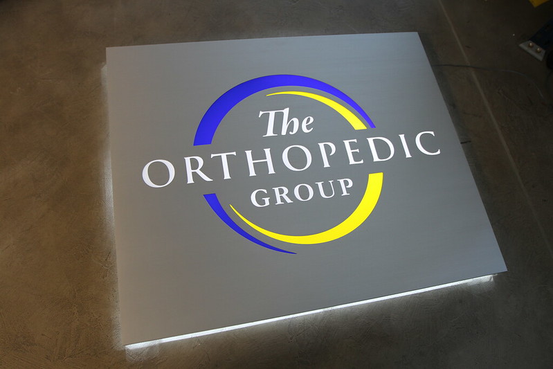 Shoebox panel design with a backlit halo sign