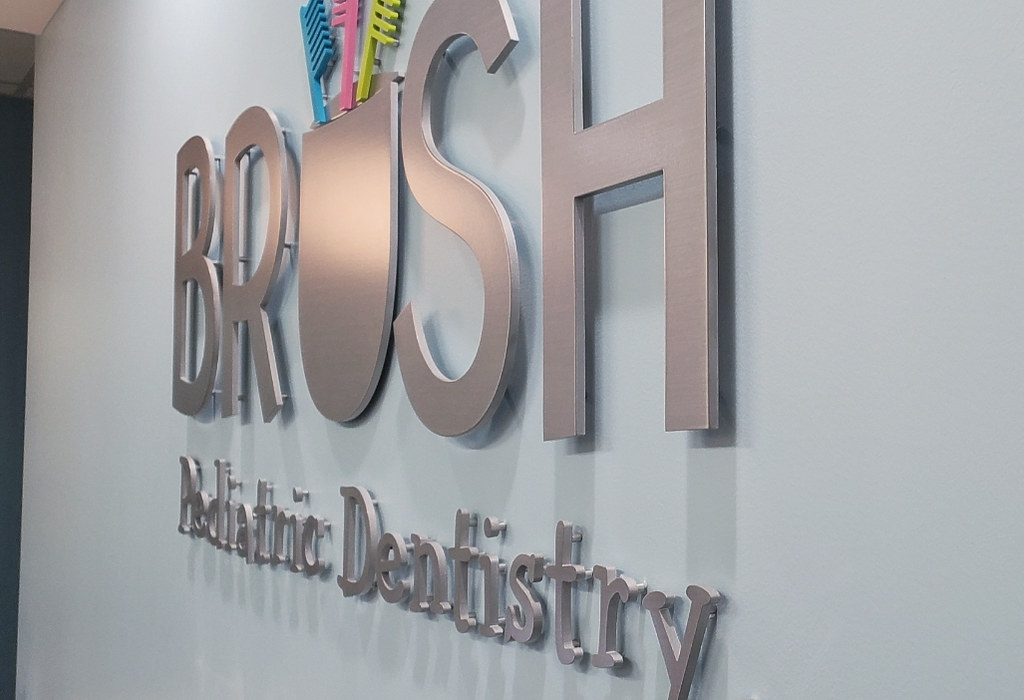 Cut metal letters for a dentistry sign.