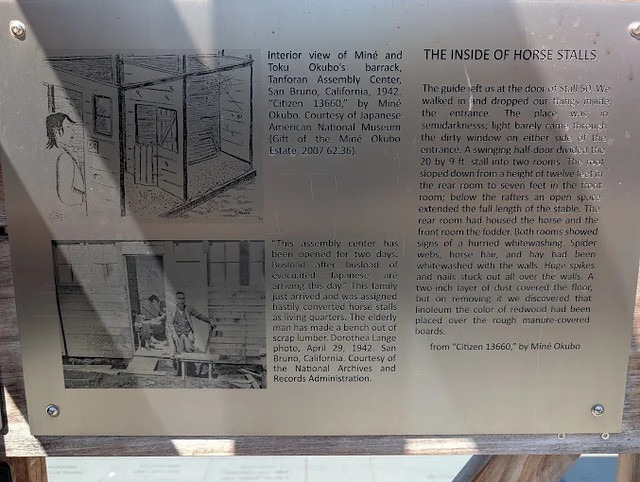 A Plaque with Images and Text That Tells the Story of Tanforan.