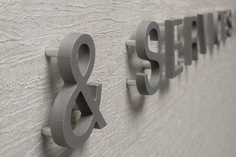 Cut aluminum signage for Petroleum Equipment & Services Association with a brushed finish.