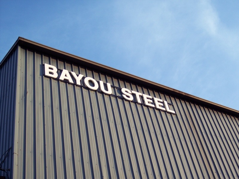 Cast Aluminum Letters, Painted Enamel White, Installed On Double Rail Mount to Corrugated Metal Wall