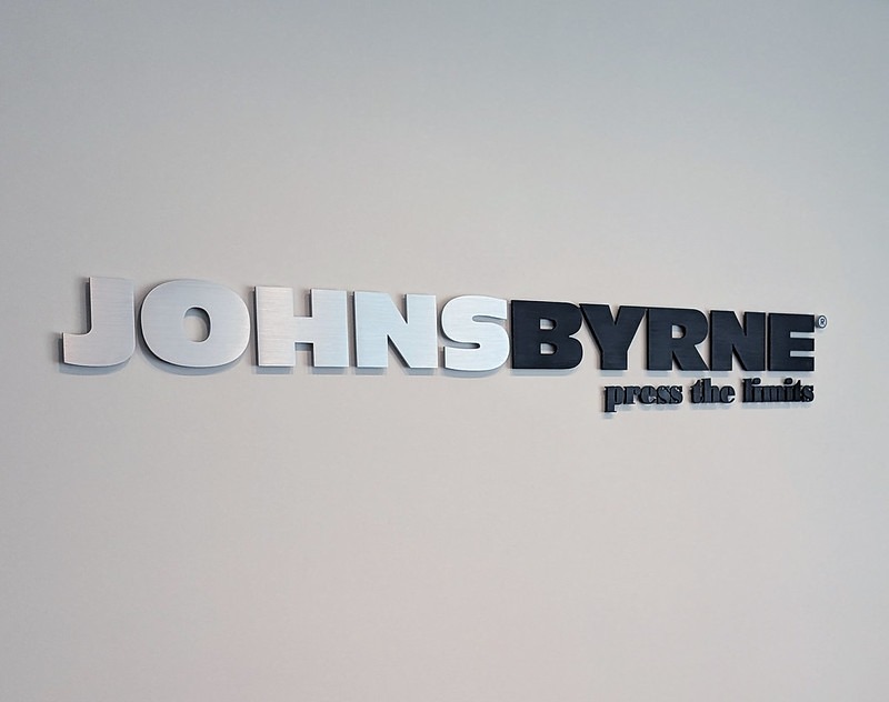 Brushed and black anodized aluminum signage for Johns Byrne by Impact Signs.