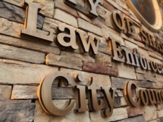 Cast bronze letters with medium oxidized finish - Village Hall