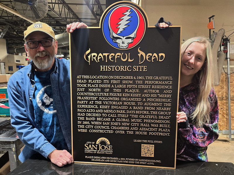 The Impact Signs team proudly displaying the finished bronze plaque for the Grateful Dead Historic Site in San Jose, CA
