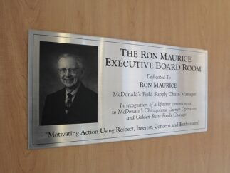 A stainless steel UV-printed dedication plaque for The Ron Maurice Executive Board Room.