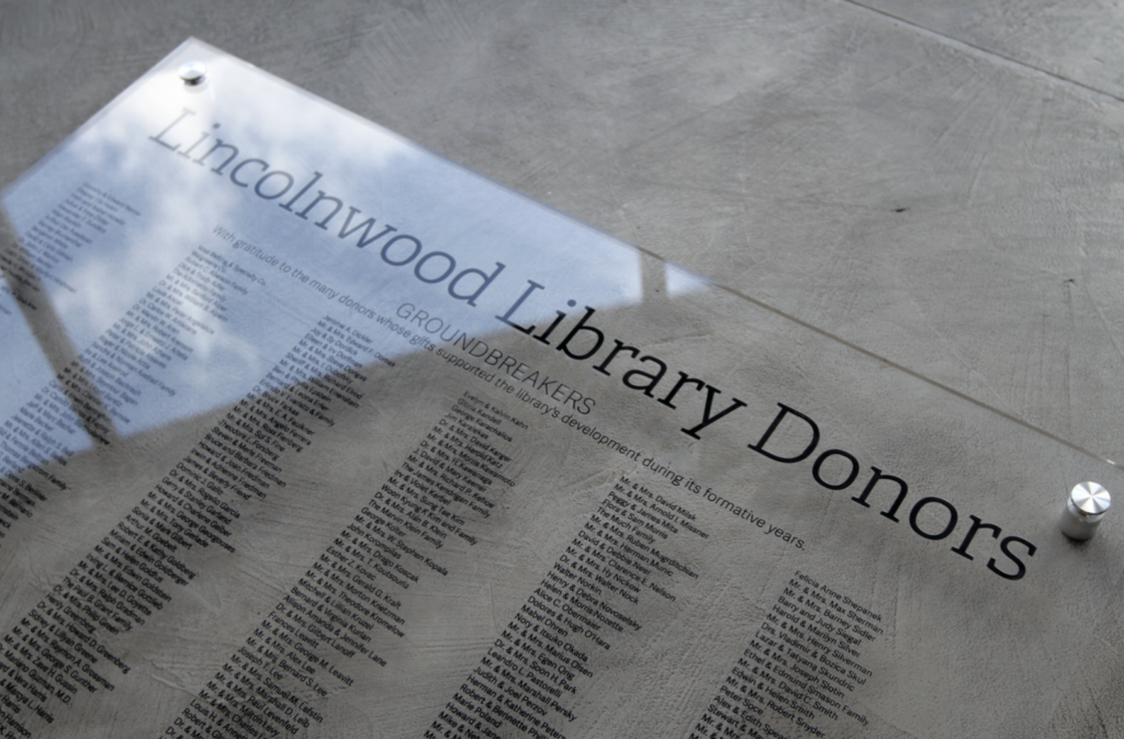 A glass sign for donor recognition created by Impact Signs near Chicago.