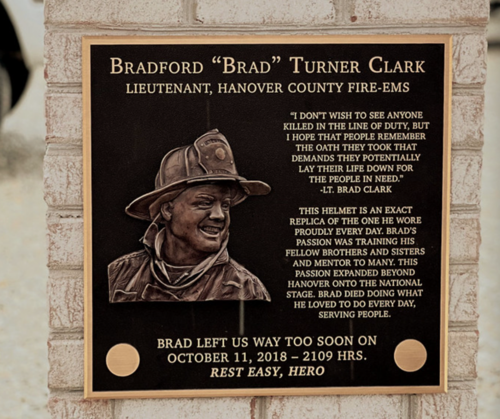 A bronze firefighter plaque by Impact Signs.