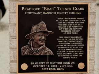 A bronze firefighter plaque by Impact Signs.