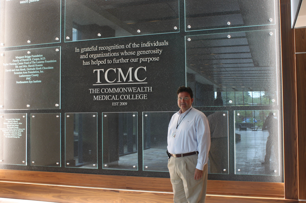 A glass donor wall for TCMC created by Impact Signs.