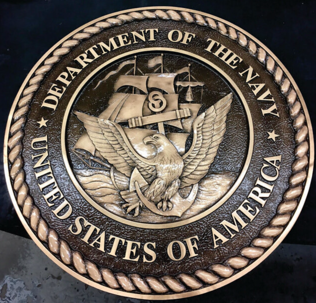 A bronze cast of the US Navy seal.